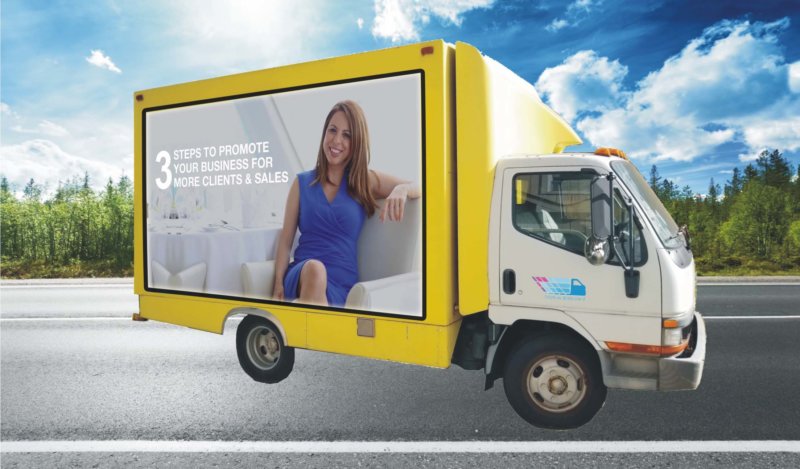 Yellow Truck 1 e1542340642235 - Mobile Billboard Services